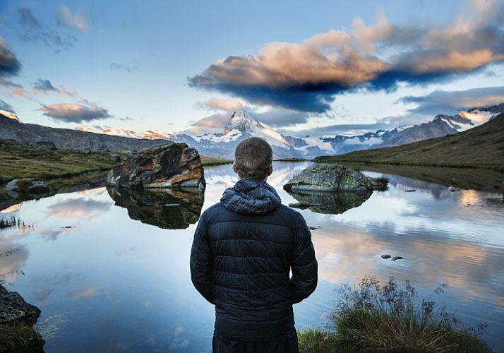 man standing at lake